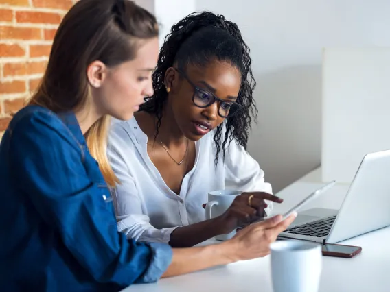 Two women managing content