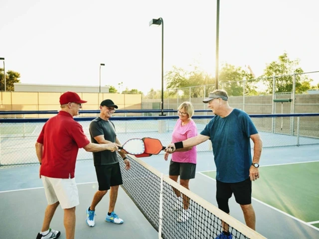 Four older people playing pickleball