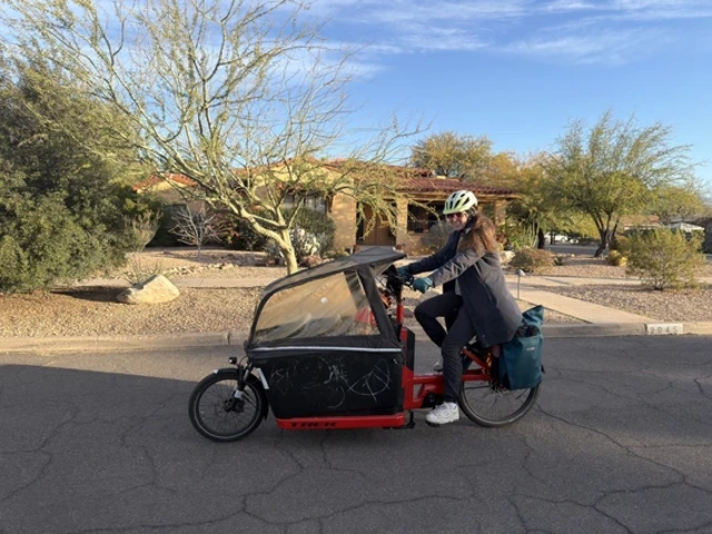 Marielle Hegetschweiler riding an electric bike down a street