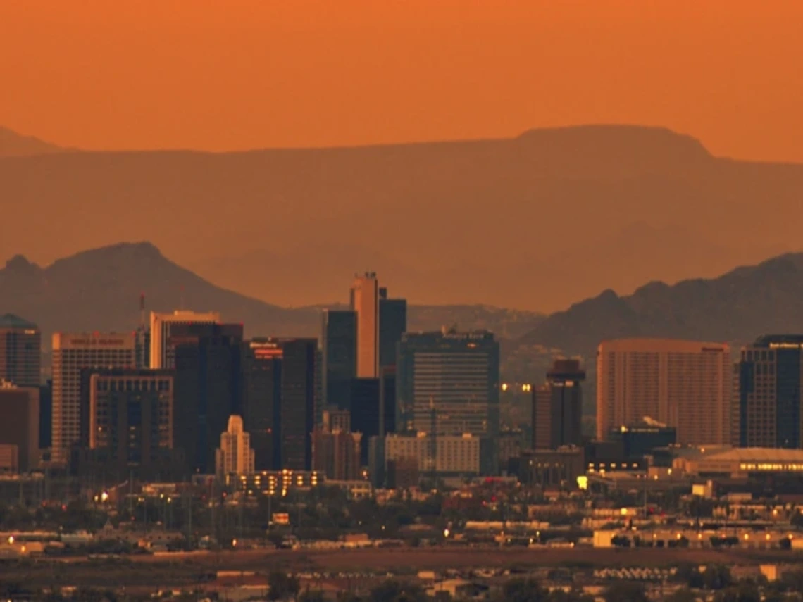 the phoenix skyline under a blistering sunset