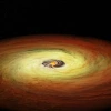 An artist's impression of a planet-forming disk, with its gas and dust illuminated in yellow and orange, swirling around a low-mass star. 